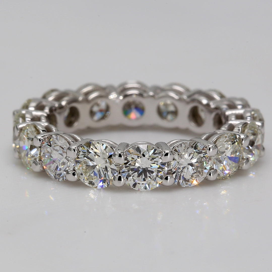 Eternity band in platinum with shared prong basket set (16) round diamonds.  D5.12ct.t.w.  Size 6.25
