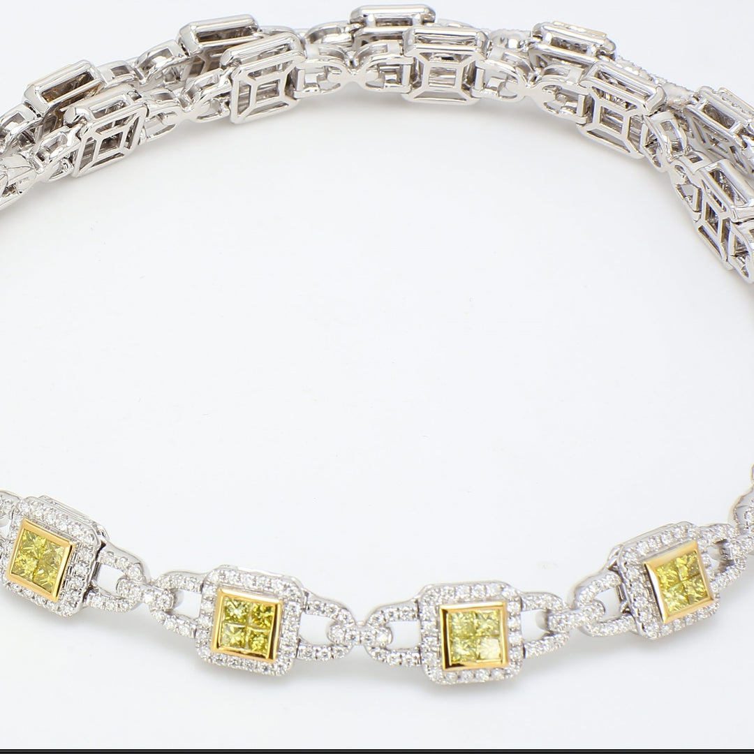 Halo necklace in two-tone with pave set round diamonds & 2x2 invisible set fancy yellow princess cut diamonds.  D5.61ct.t.w.