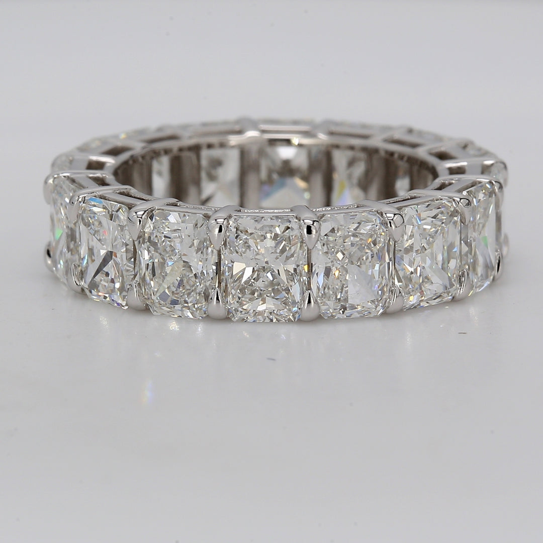 Eternity band in platinum with shared eagle claw set F+/VVS-VS (16) radiant cut diamonds.  D8.95ct.t.w.  Size 5.75