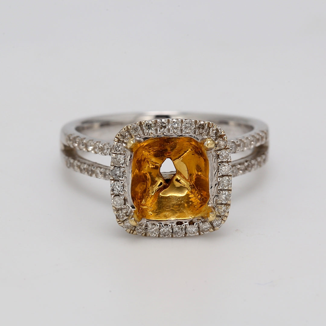 Halo semi-mount in 18K WG with french pave set round diamonds.  D0.60ct.t.w.