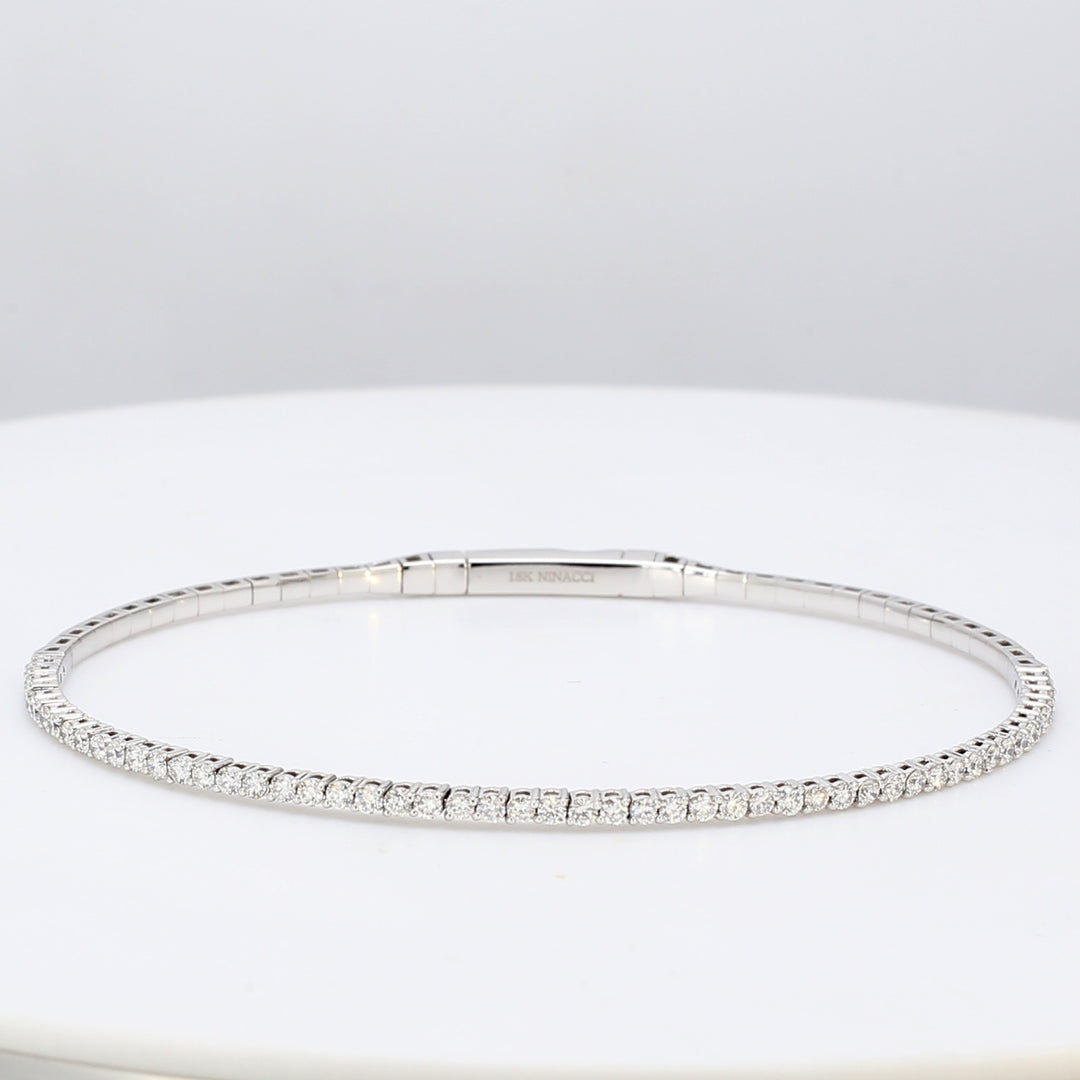 6.5"" Lightweight flexible oval bangle in 18K WG with prong set round diamonds.  D1.04ct.t.w.