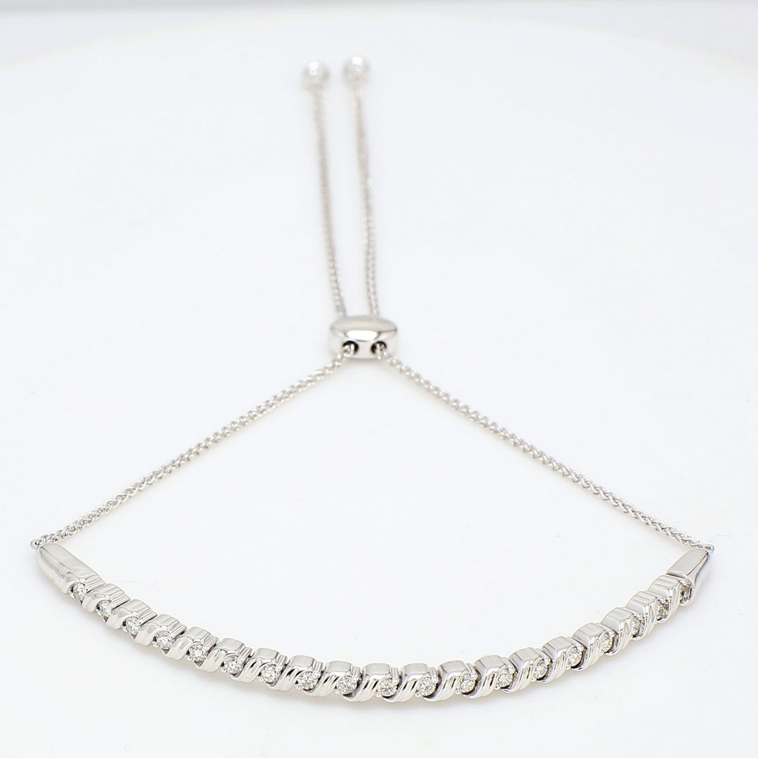 Knot draw string S-style curve bangle in 18K WG with prong set round diamonds.  D0.33ct.t.w.