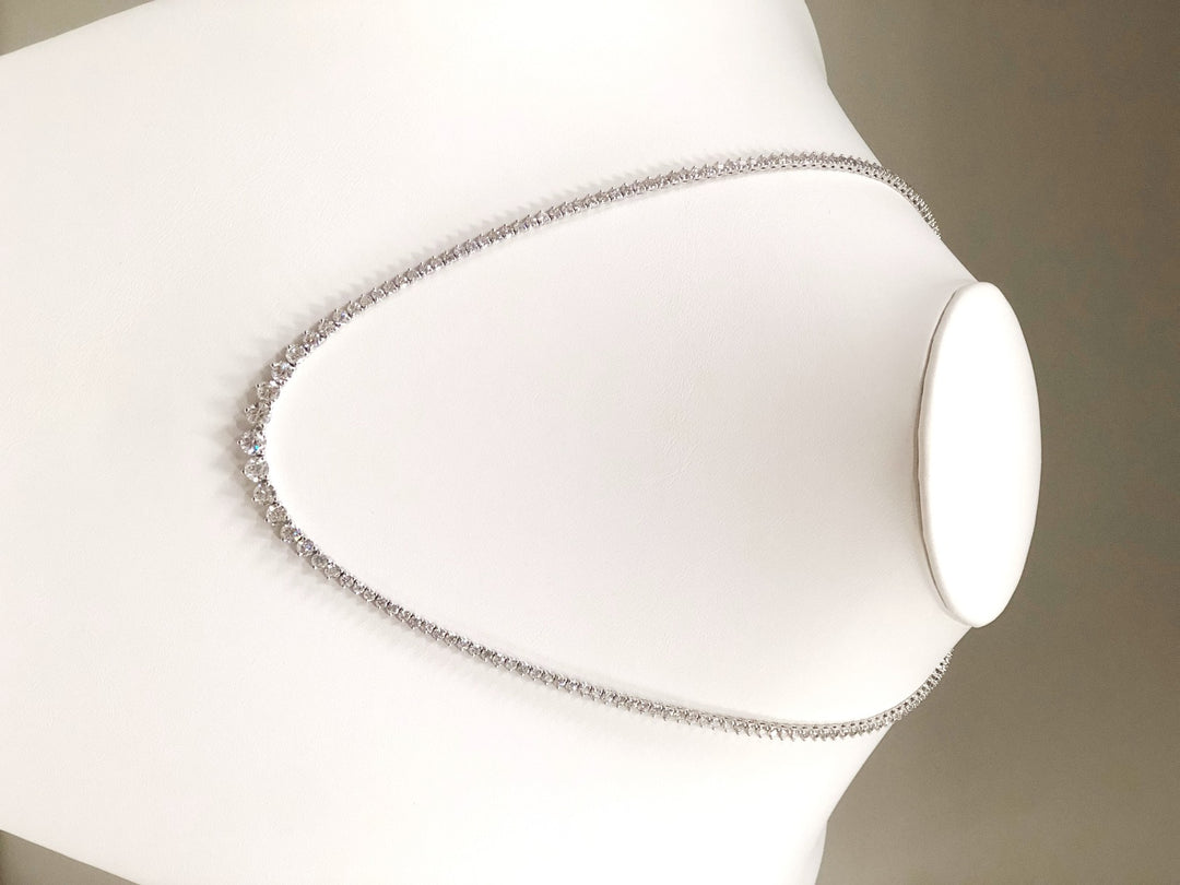 17"" Graduated tennis necklace in 18K WG with 3-prong set (174) round diamonds.  D7.25ct.t.w.
