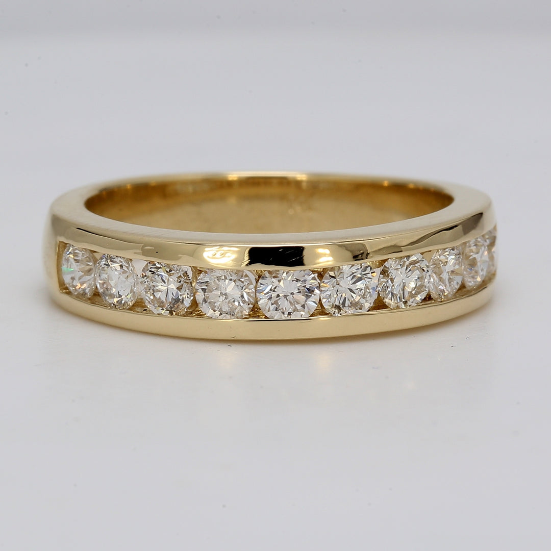 Ring in yellow gold with channel set round diamonds.  D1.25ct.t.w.  Size 9.75