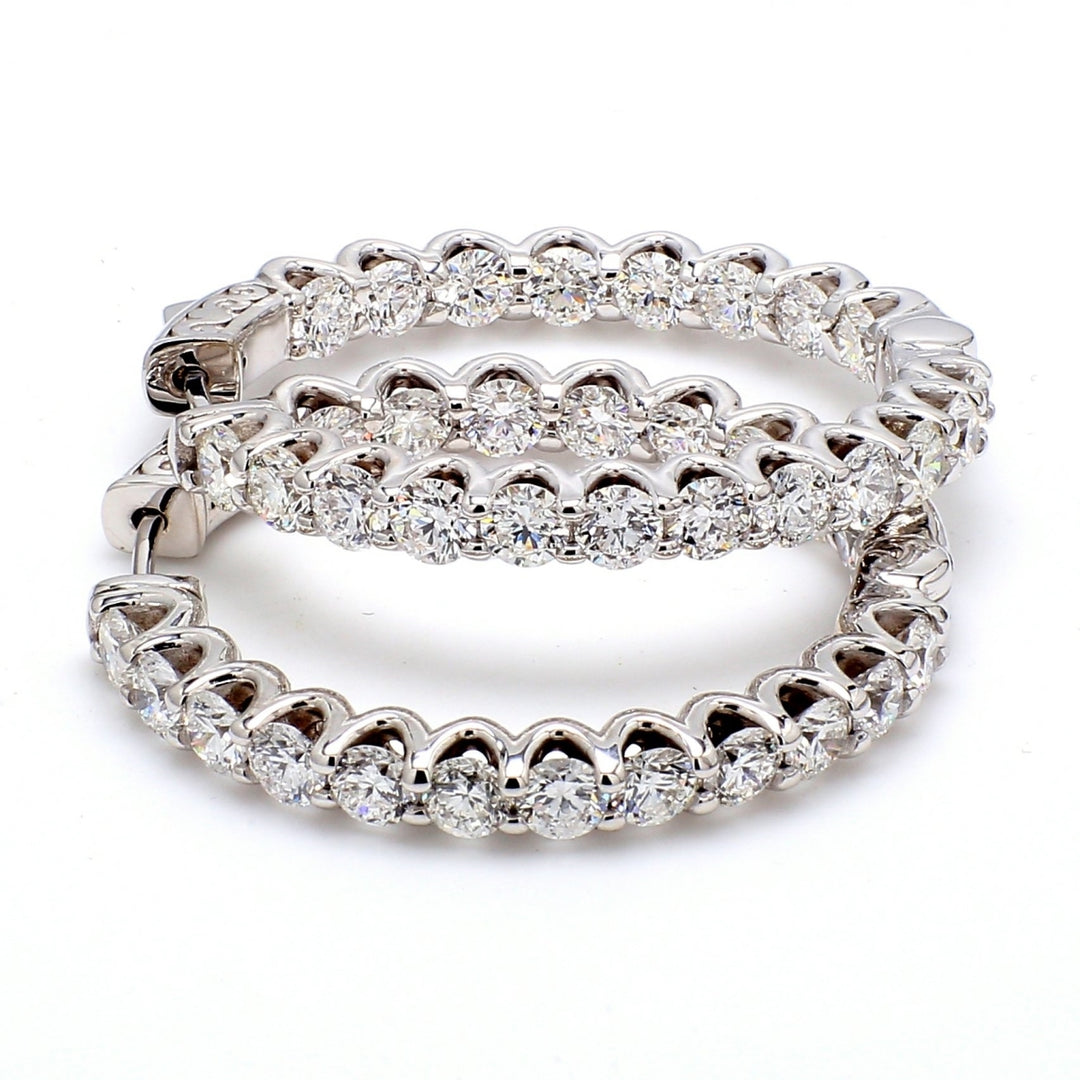 1"" Inside out hoop earrings with U-prong set (46) round diamonds & with special spring lock.  D1.56ct.t.w.