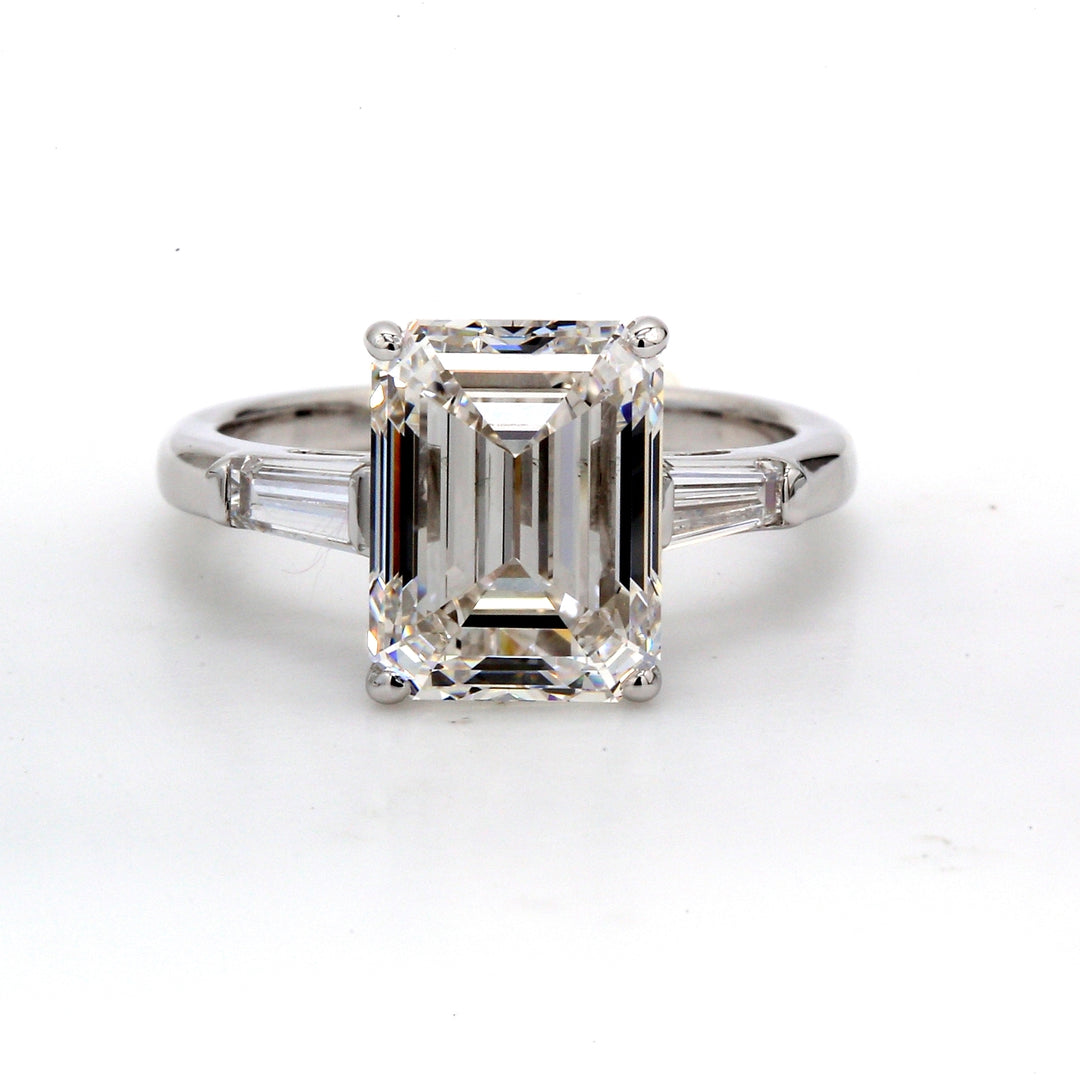 3-stone semi-mount with a pair of channel set tapered baguette diamond sides.  D0.36ct.t.w.  Size 4.5