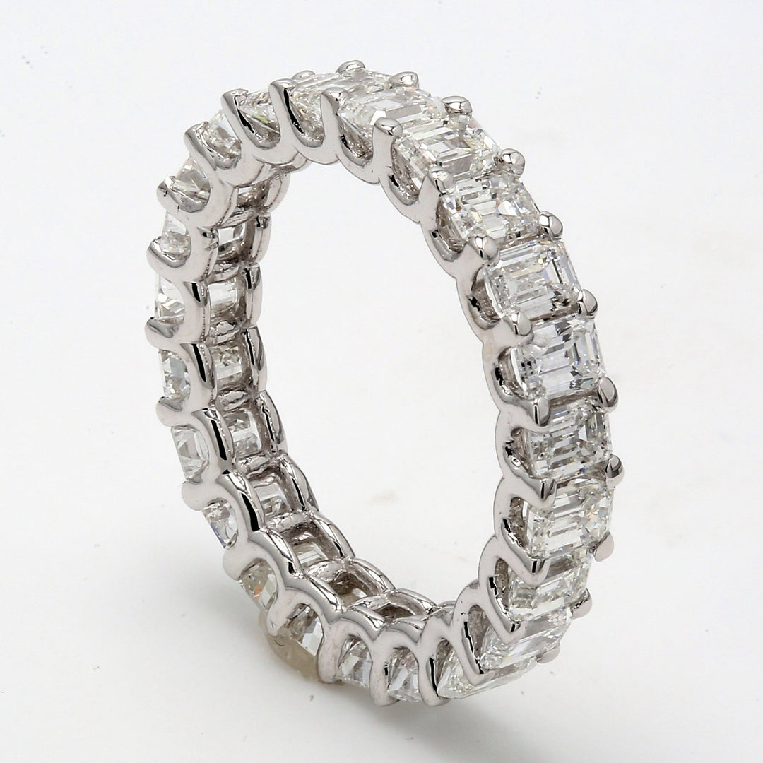 Eternity band with shared U-prong set (24) round diamonds.  D5.58ct.t.w.  Size 5.75