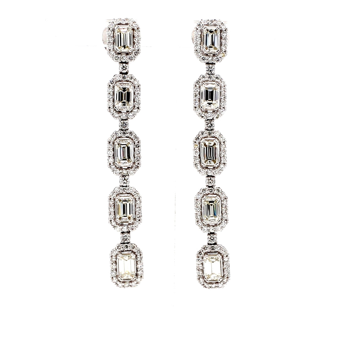 Halo dangling earrings with double 4-prong set emerald cuts & prong set round diamonds.  D3.91ct.t.w.