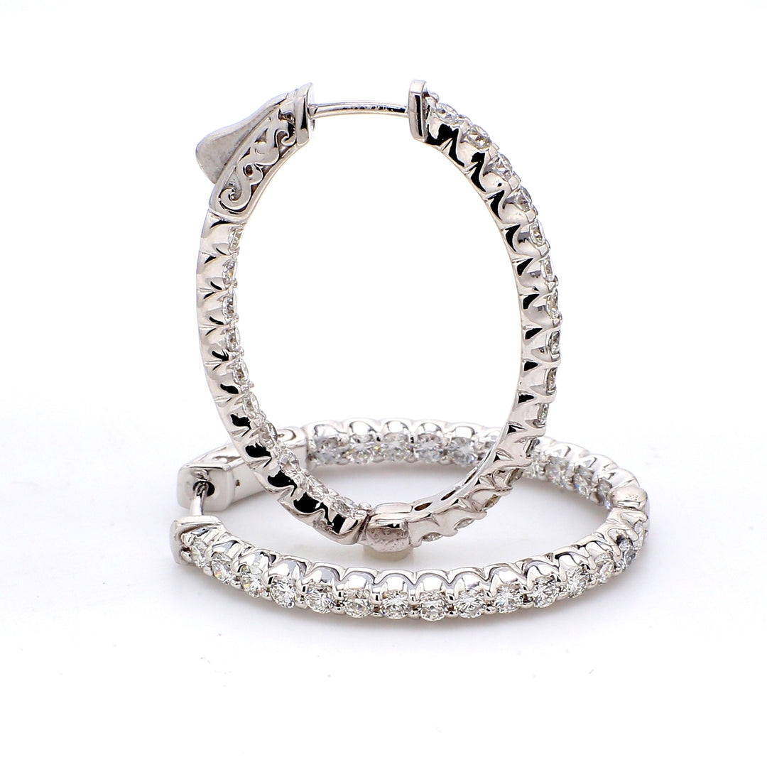 0.75"" Oval shaped inside out hoop earrings with U-prong set (24) round diamonds & with special spring lock.  D0.87ct.t.w.
