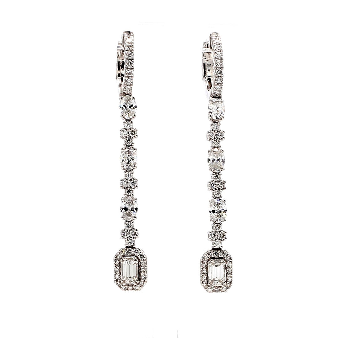 Halo dangling earrings with prong set round, oval, & emerald cut diamonds.  D2.52ct.t.w.