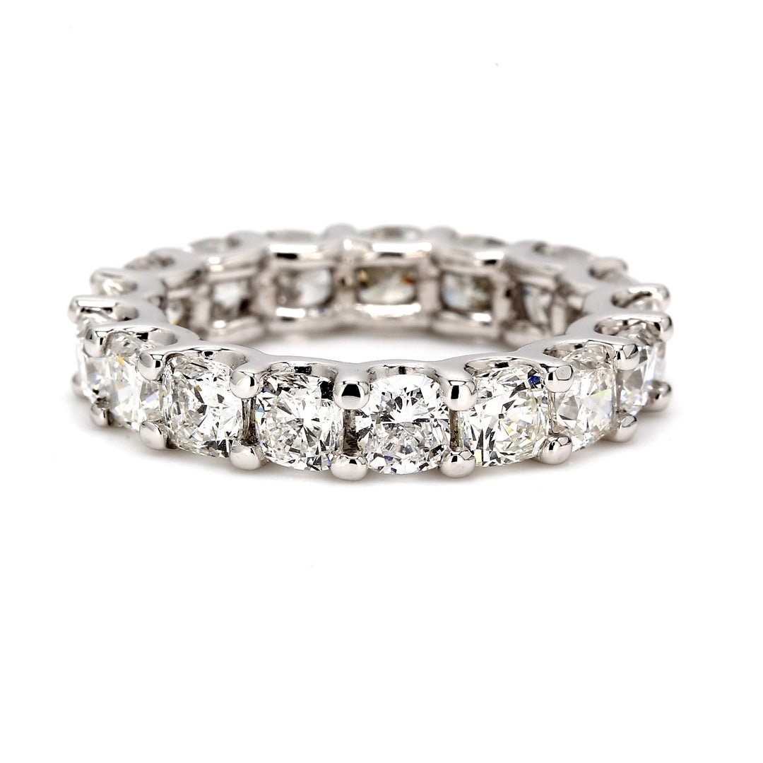 Eternity band with U-prong set (17) cushion cut diamonds.  D5.62ct.t.w.  Size 5.75