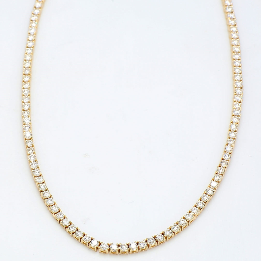 18"" Tennis necklace in yellow gold with 4-prong set round diamonds.  D7.16ct.t.w.