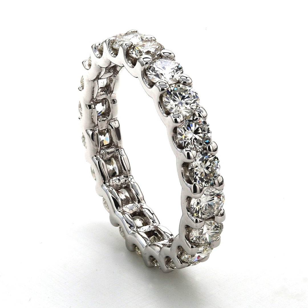 Eternity band with shared U-prong set round diamonds.  D2.40ct.t.w.