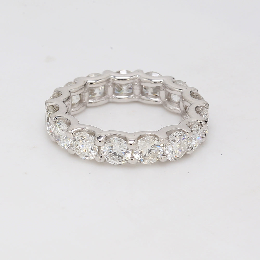 Eternity band with shared U-prong set round diamonds.  D3.88ct.t.w.  Size 4.5