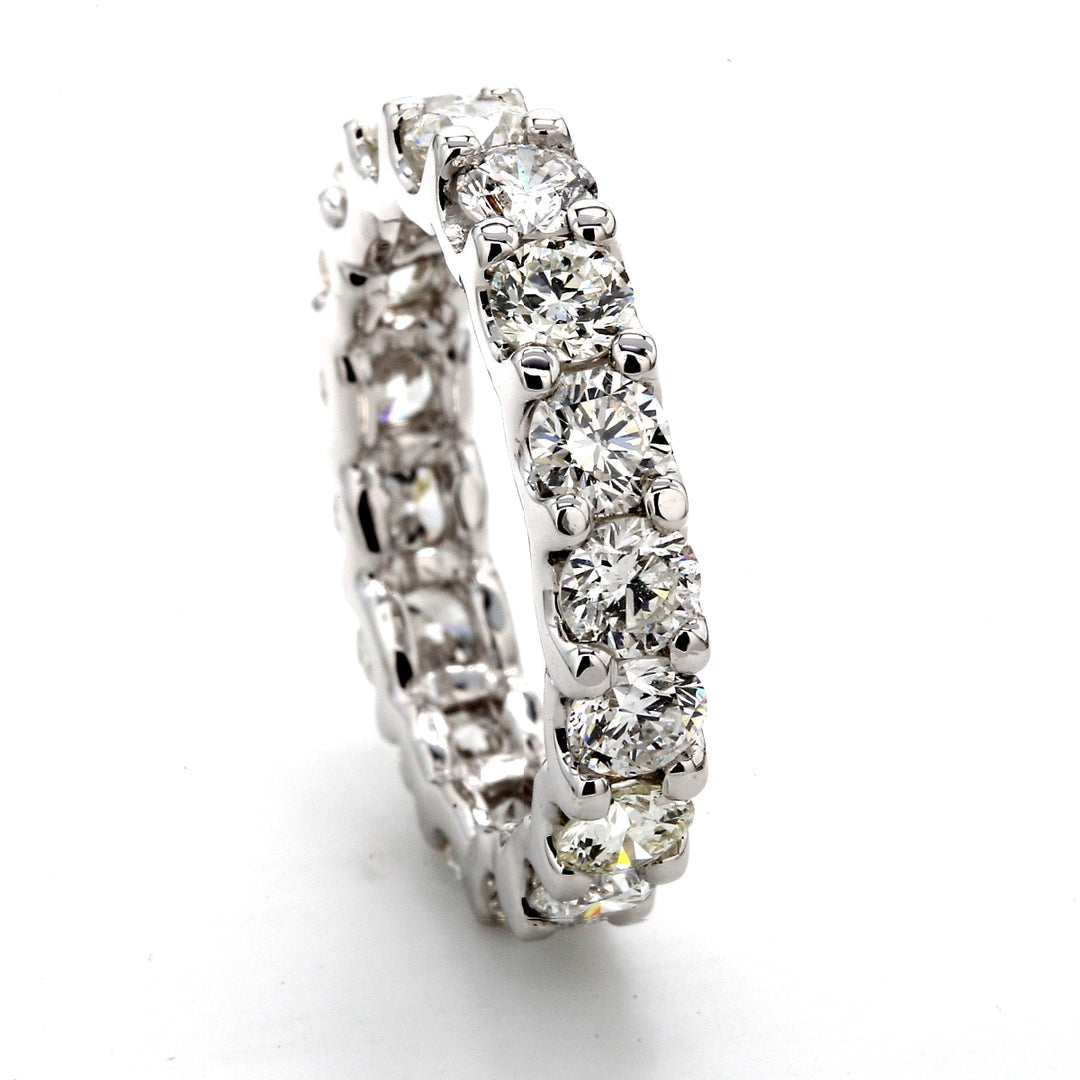 Eternity band with shared U-prong set round diamonds.  D3.16ct.t.w.