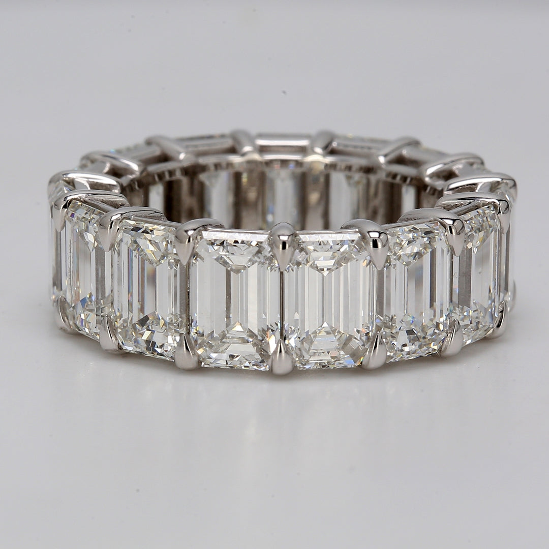 Eternity band in platinum with eagle claw basket set GIA certified F-G/VVS1-VS2 (15) emerald cut diamonds.  D15.38ct.t.w.  Size 6.5
