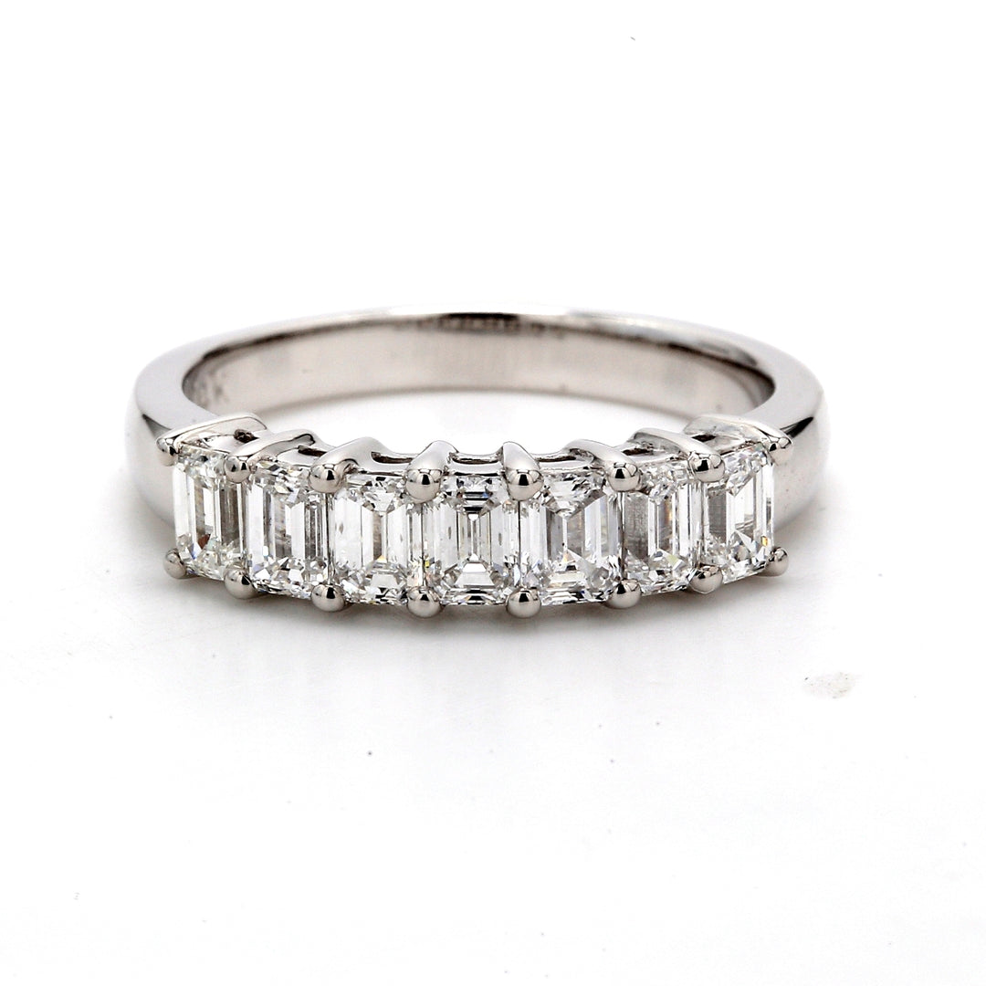 7-stone band with shared prong set emerald cut diamonds.  D1.21ct.t.w.