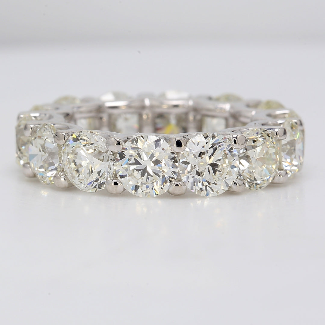 Eternity band in platinum with U-prong set round diamonds.  D9.99ct.t.w.  Size 6