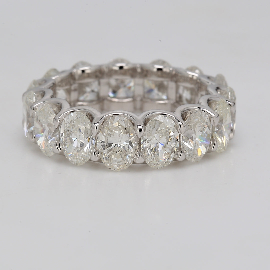 Eternity band in platinum with U-prong set G/SI (15) oval diamonds.  D7.54ct.t.w.  Size 6.75