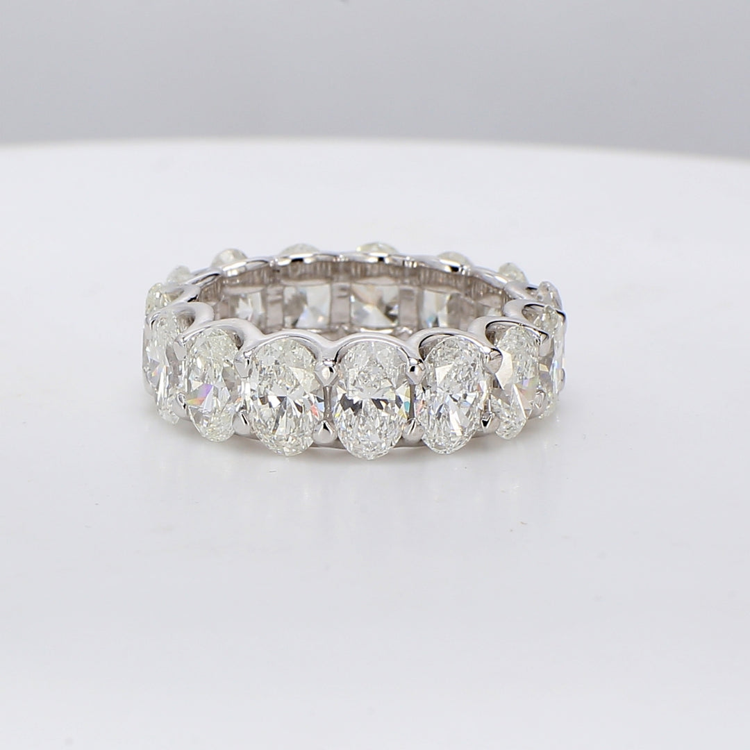 Eternity band in platinum with U-prong set G/SI (15) oval diamonds.  D7.88ct.t.w.  Size 7
