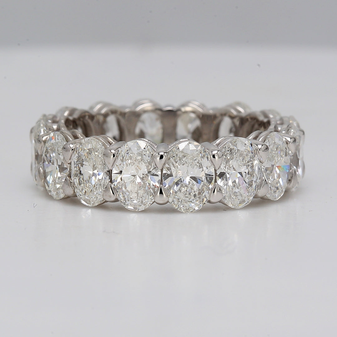 Eternity band in platinum with basket eagle claw set VS-SI1 (16) oval diamonds.  D5.05ct.t.w.  Size 5.5