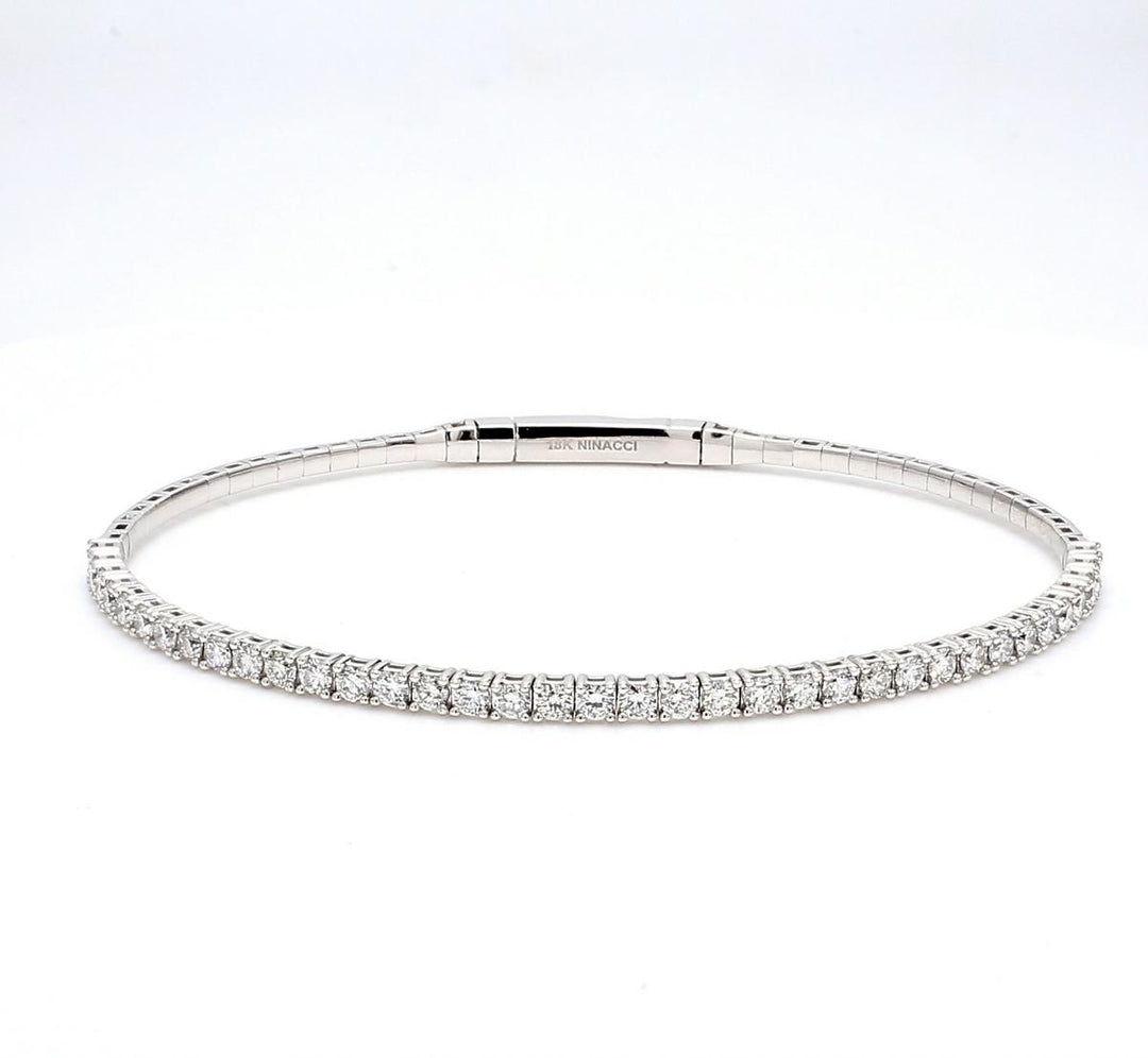 7.25"" Light flexible bangle in 18K WG with prong set round diamonds.  D1.44ct.t.w.