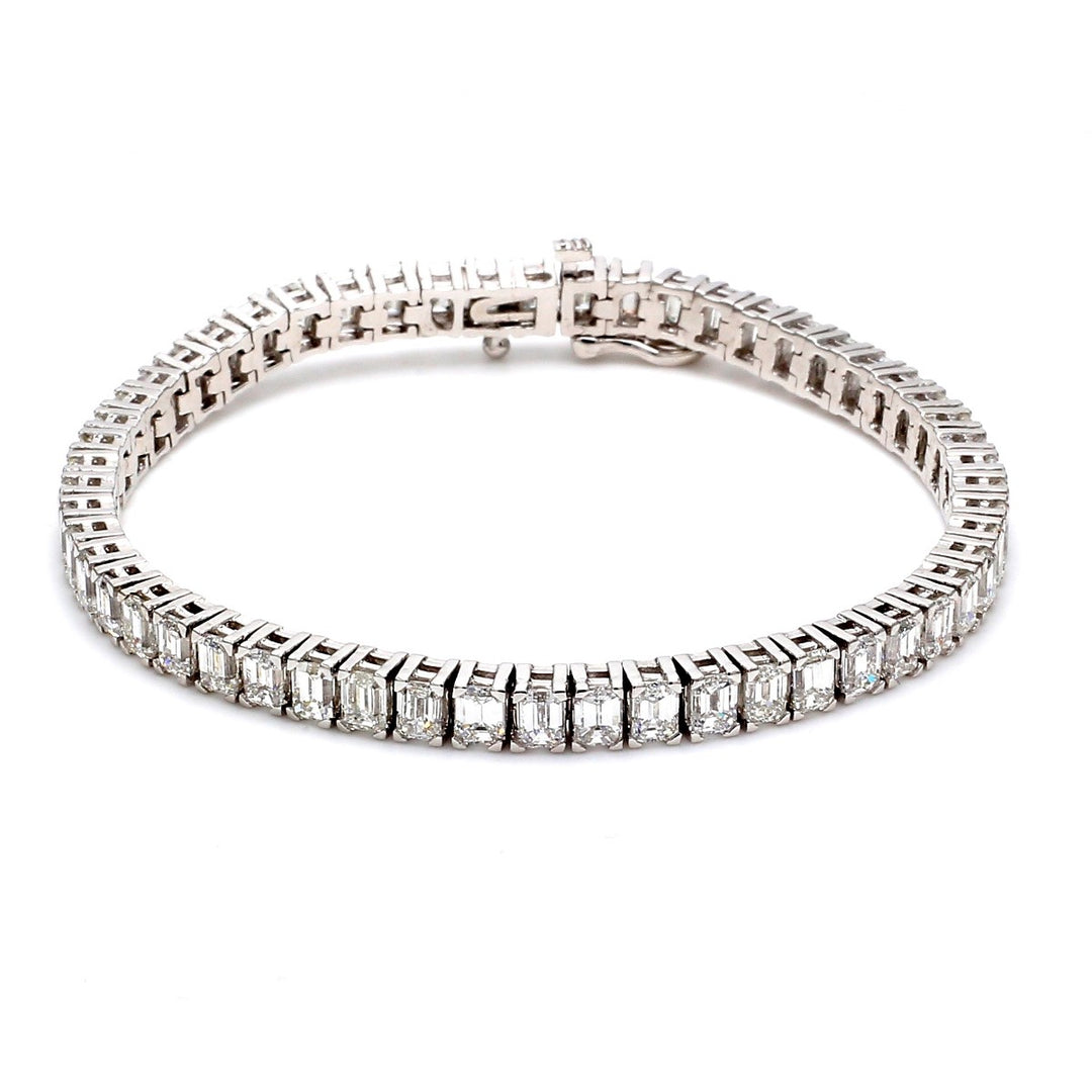 7"" Tennis bracelet with 4-prong set emerald cut diamonds.  D12.99ct.t.w.