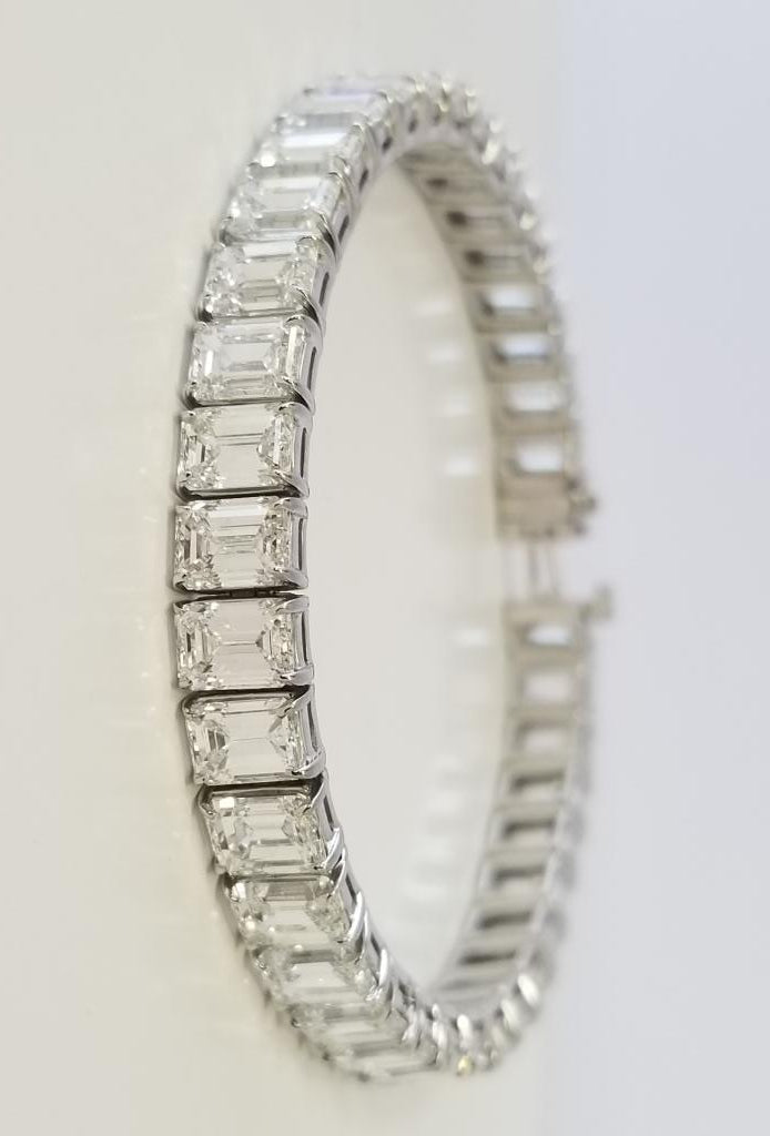 7"" Tennis bracelet in platinum with basket eagle claw set GIA certified G-I/VVS-VS emerald cut diamonds.  D22.19ct.t.w.