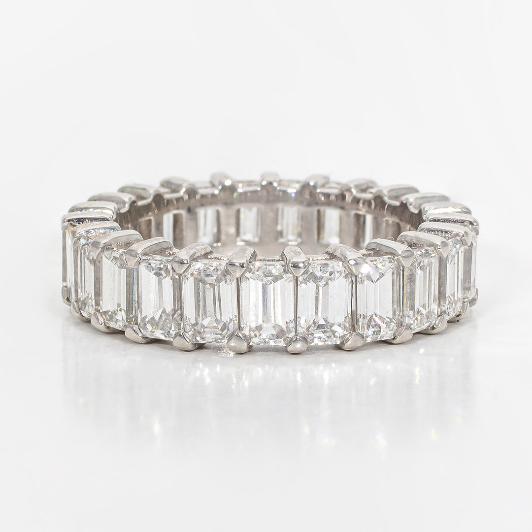 Eternity band in platinum with shared prong set (23) emerald cut diamonds.  D4.61ct.t.w.  Size 6