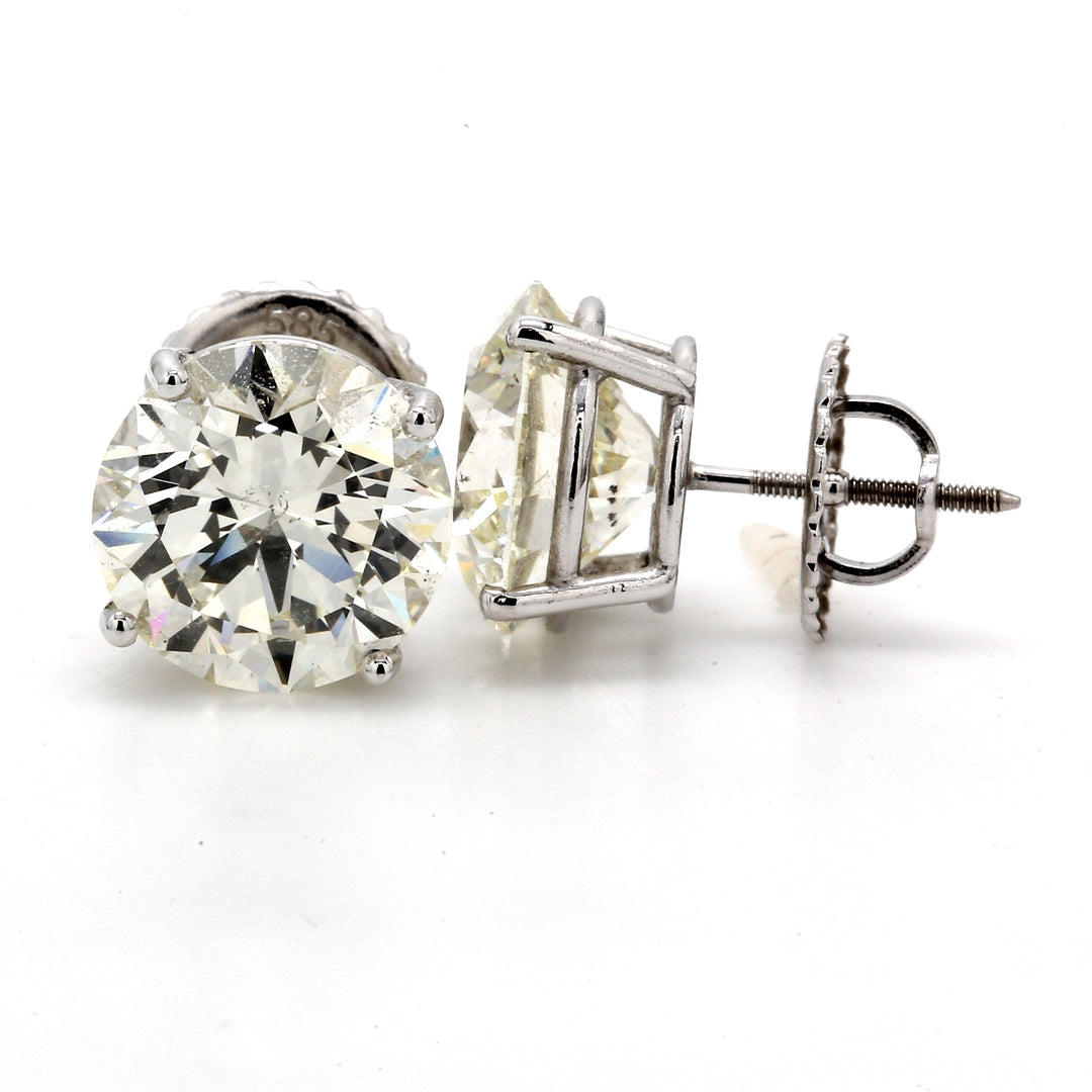 Stud earrings with 4-prong set GIA certified M/SI1-SI2 round diamonds.  D8.04ct.t.w.