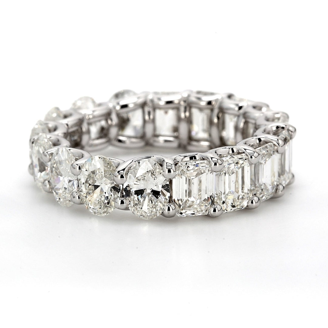 Eternity band in platinum with shared U-prong set oval & GIA certified G-I/VVS1-VS2 emerald cut diamonds.  D8.30ct.t.w.