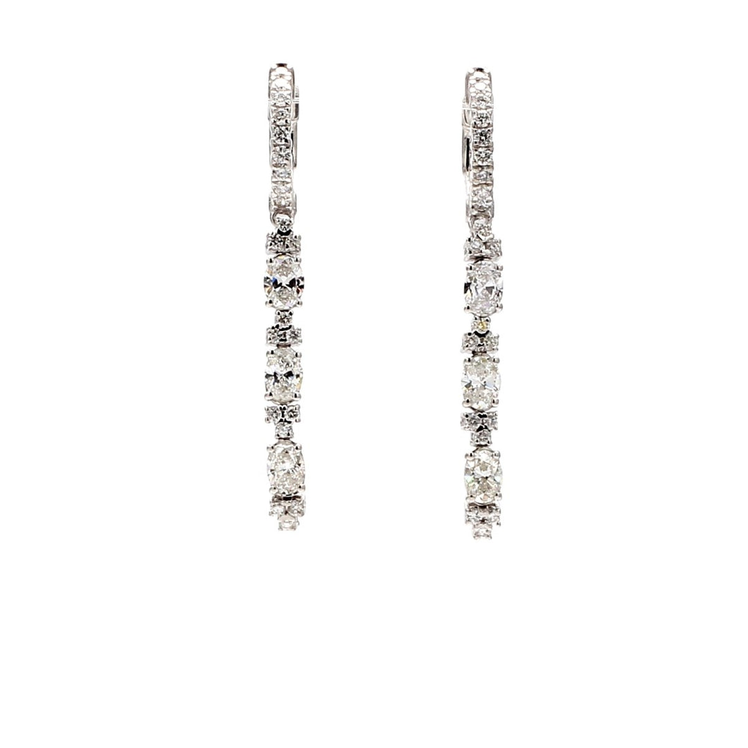 Dangling earrings with 4-prong set oval & round diamonds.  D1.62ct.t.w.