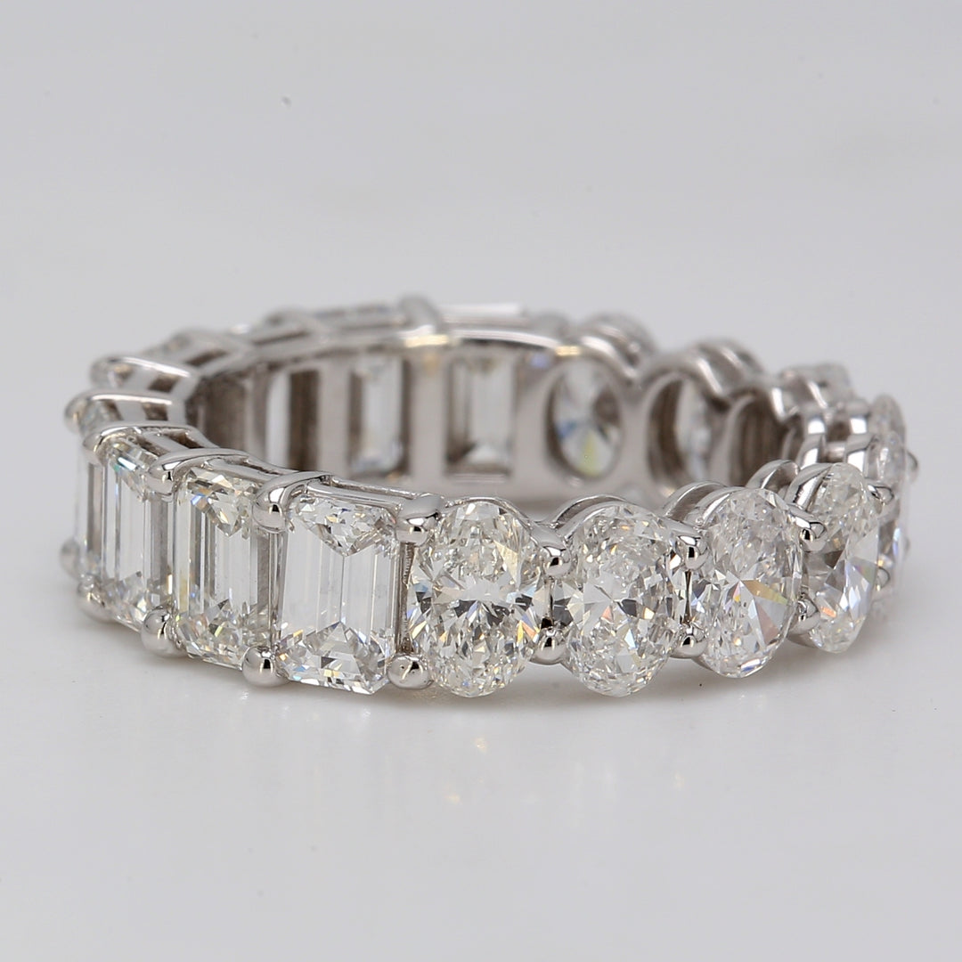 Eternity band in platinum with basket prong set VVS-VS oval & emerald cut diamonds.  D5.40ct.t.w.  Size 5.5