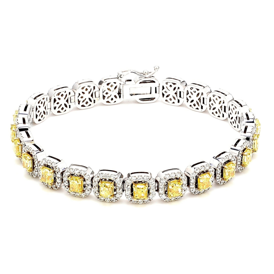 7"" Tennis halo bracelet in 18K WG with french pave set rounds around prong set fancy intense yellow cushion cut diamond centers.  D9.94ct.t.w.  Fancy Intense Yellow 7.02ct.t.w.