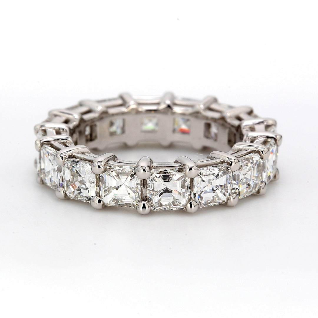 Eternity band in platinum with shared prong set D-F/VVS-VS asscher cut diamonds.  D4.76ct.t.w.