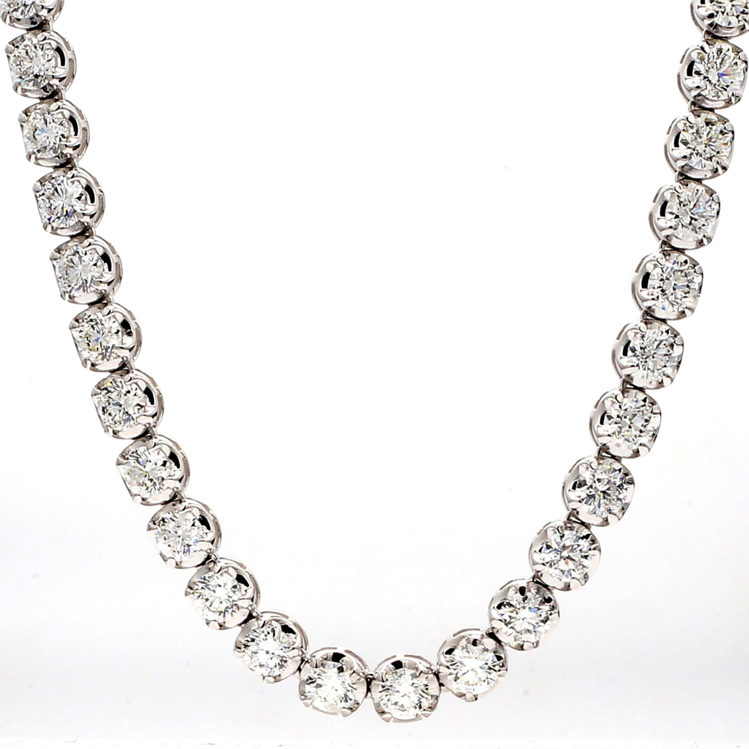 17"" Tennis necklace in 18K WG with illusion style 4-prong set (71) round diamonds.  D21.71ct.t.w.