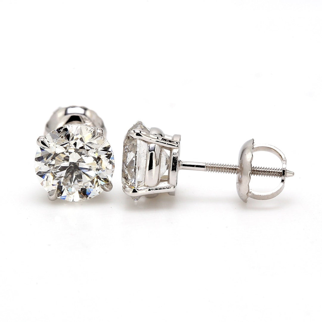 Screw back stud earrings with 4-prong set round diamonds.  D2.39ct.t.w.