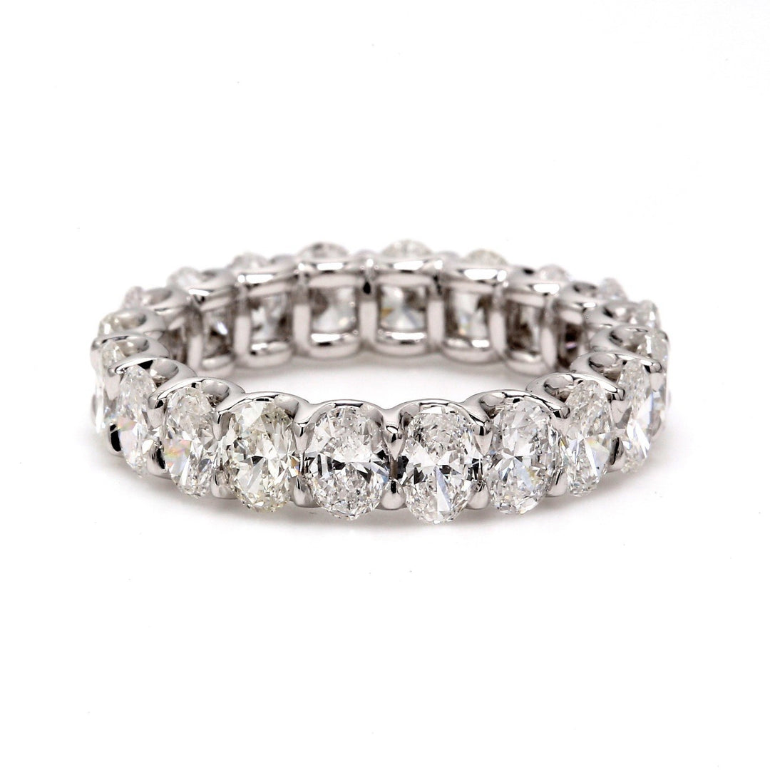 Eternity band in platinum with shared U-prong set E-F/VS1-VS2 oval diamonds.  D3.93ct.t.w.