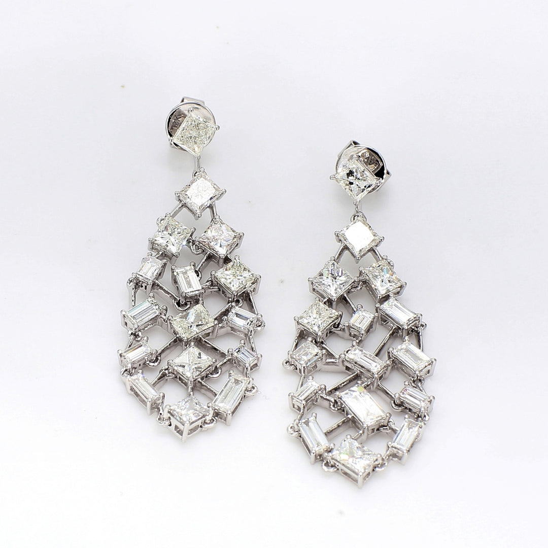 Free style chandelier earrings in 18K WG with prong set baguette & princess cut diamonds.  D6.34ct.t.w.