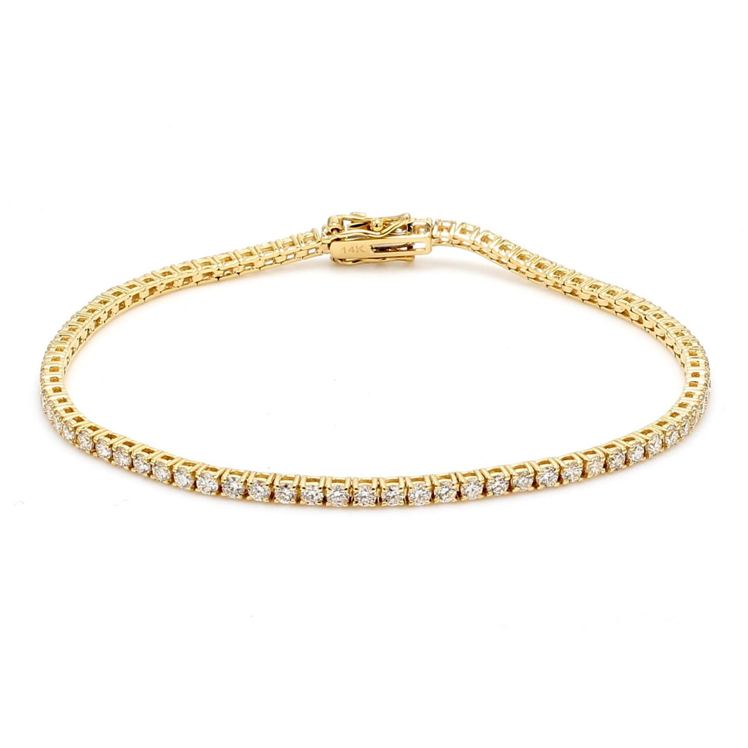 7.5"" Tennis bracelet in yellow gold with prong set round diamonds.  D2.39ct.t.w.