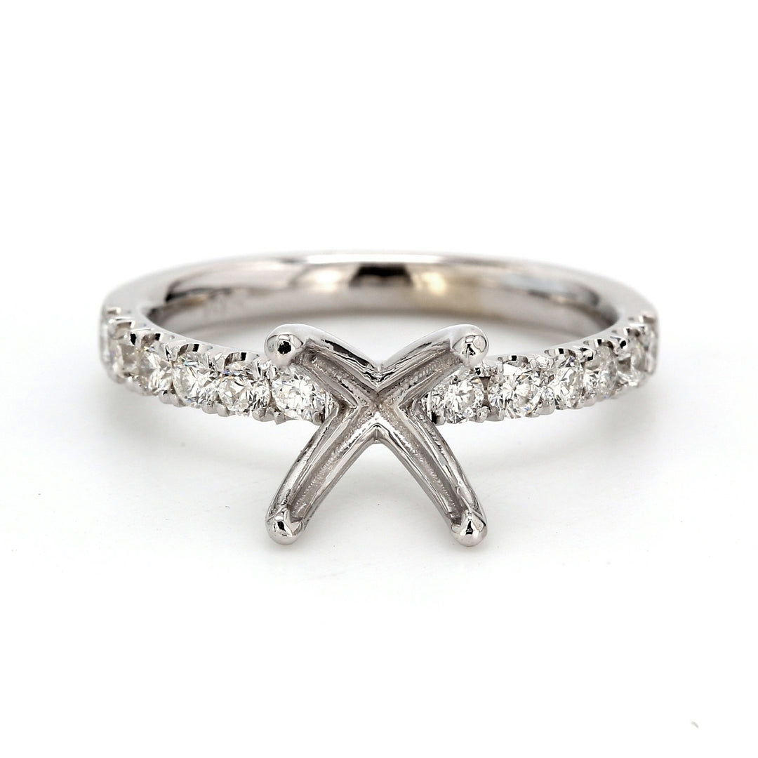 Semi-mount with 4-prong set round diamonds.  D0.19ct.t.w.  Size 7