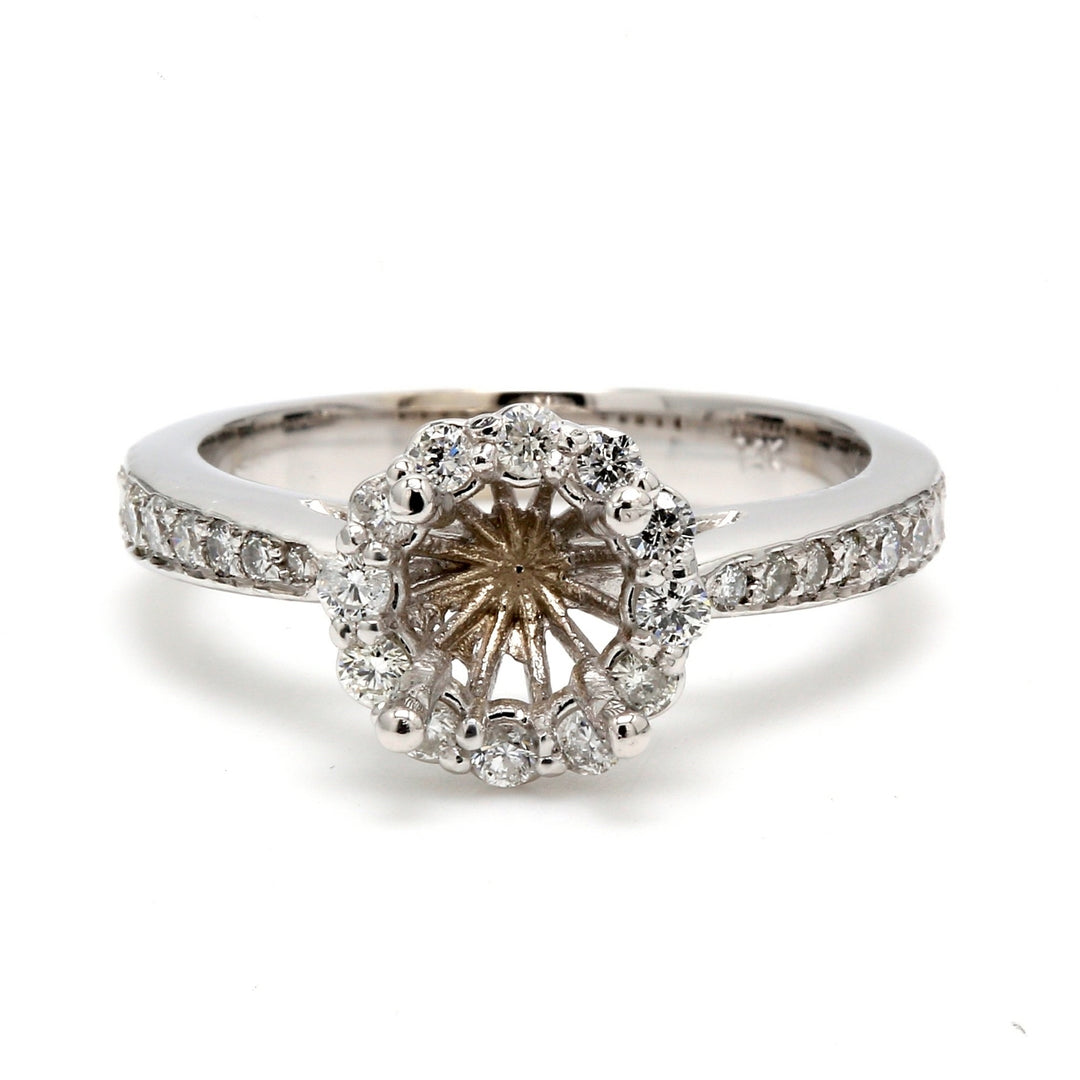 Halo semi-mount with shared prong set round diamonds.  D0.46ct.t.w.