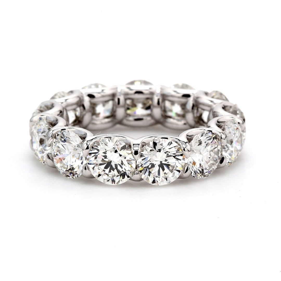 Eternity band in platinum with shared U-prong set GIA certified F/VS2-SI1 round diamonds.  D6.65ct.t.w.