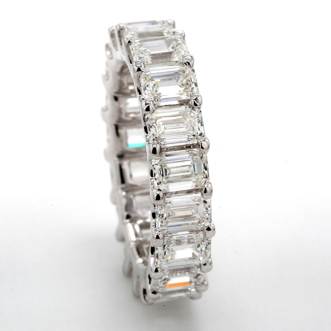 Eternity band in platinum with shared prong set GIA certified D-E/IF-VS2 (18) emerald cut diamonds.  D7.25ct.t.w.  Size 6.75