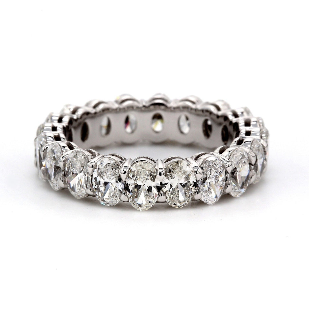 Eternity band in platinum with shared prong set F-G/VS oval diamonds.  D3.89ct.t.w.