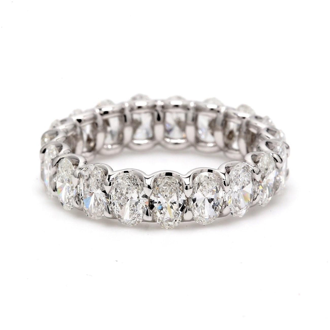 Eternity band in platinum with eagle claw U-prong set (17) oval diamonds.  D5.34ct.t.w.  Size 6.5
