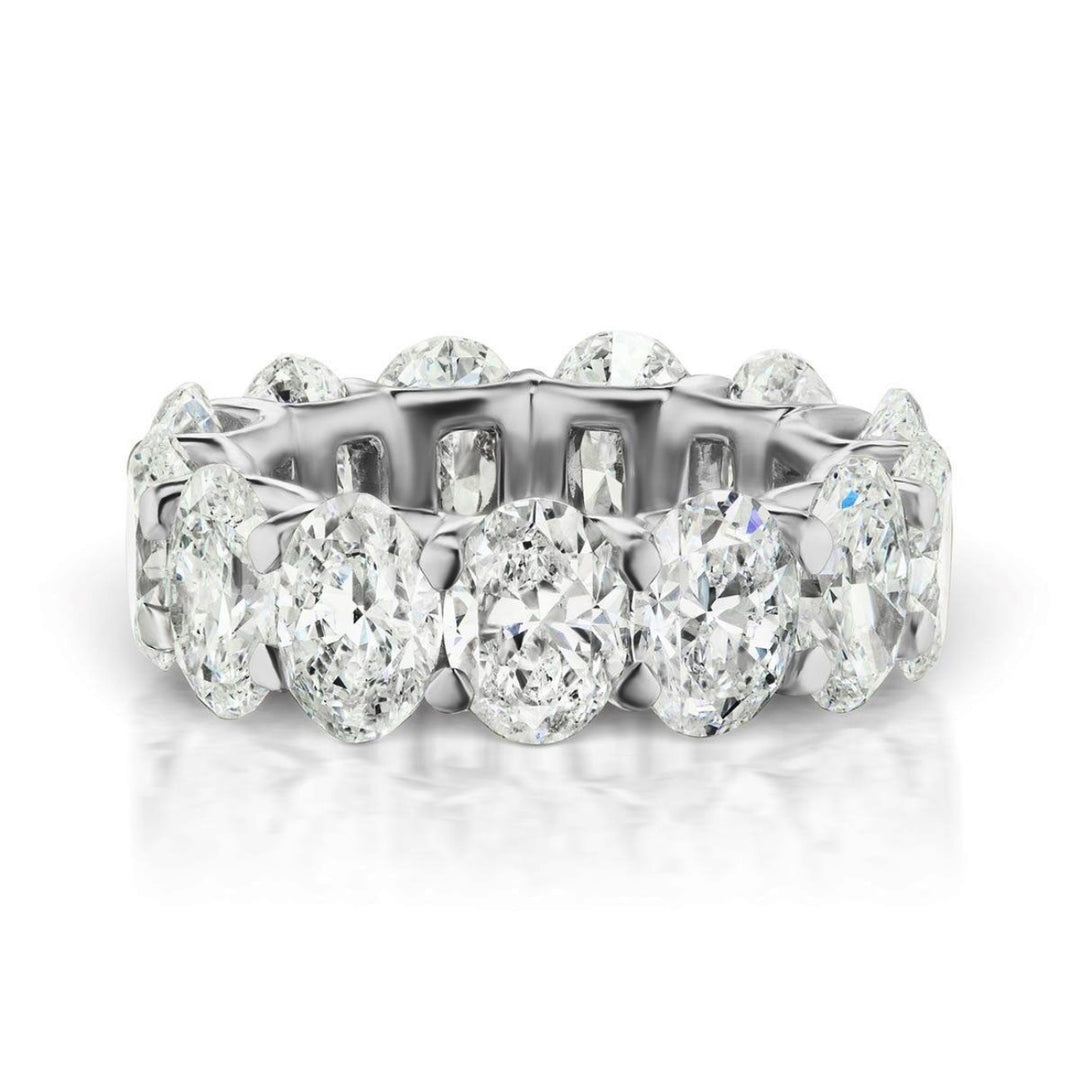 Eternity band in platinum with U-prong set (17) oval diamonds.  D5.20ct.t.w.  Size 5.75