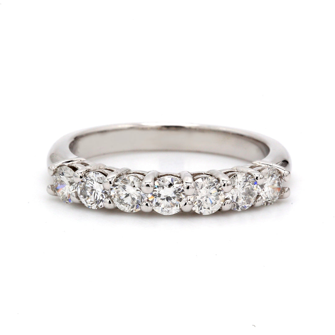 7-stone band in platinum with shared prong set round diamonds.  D1.30ct.t.w.  Size 6