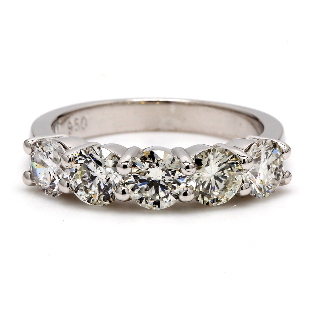 5-stone band in platinum with shared prong set round diamonds.  D2.10ct.t.w.