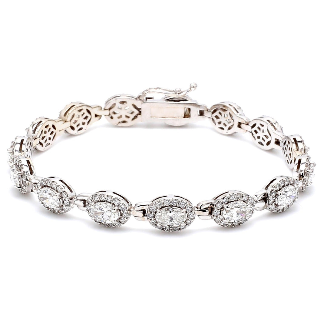 7"" Designer bracelet with shared prong set rounds and 4-prong set oval cut diamonds.  D6.96ct.t.w.